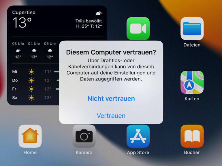 Tippe auf "Vertrauen" um Fotos von deinem iPhone auf den PC zu übertragen