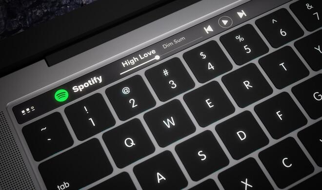 Spotify in OLED-Touchleiste am MacBook Pro mit Bedienelementen und Songinformationen.